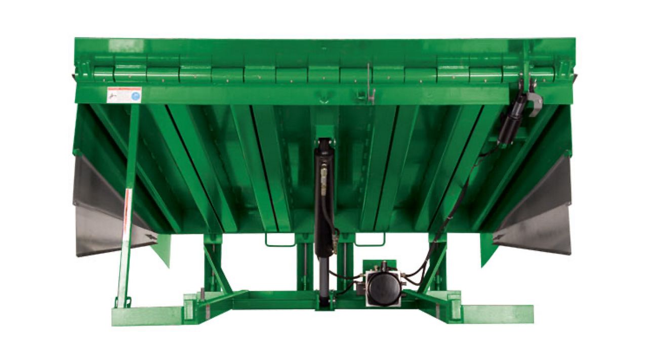 Heavy-duty hydraulic-powered pit-style loading dock leveler.