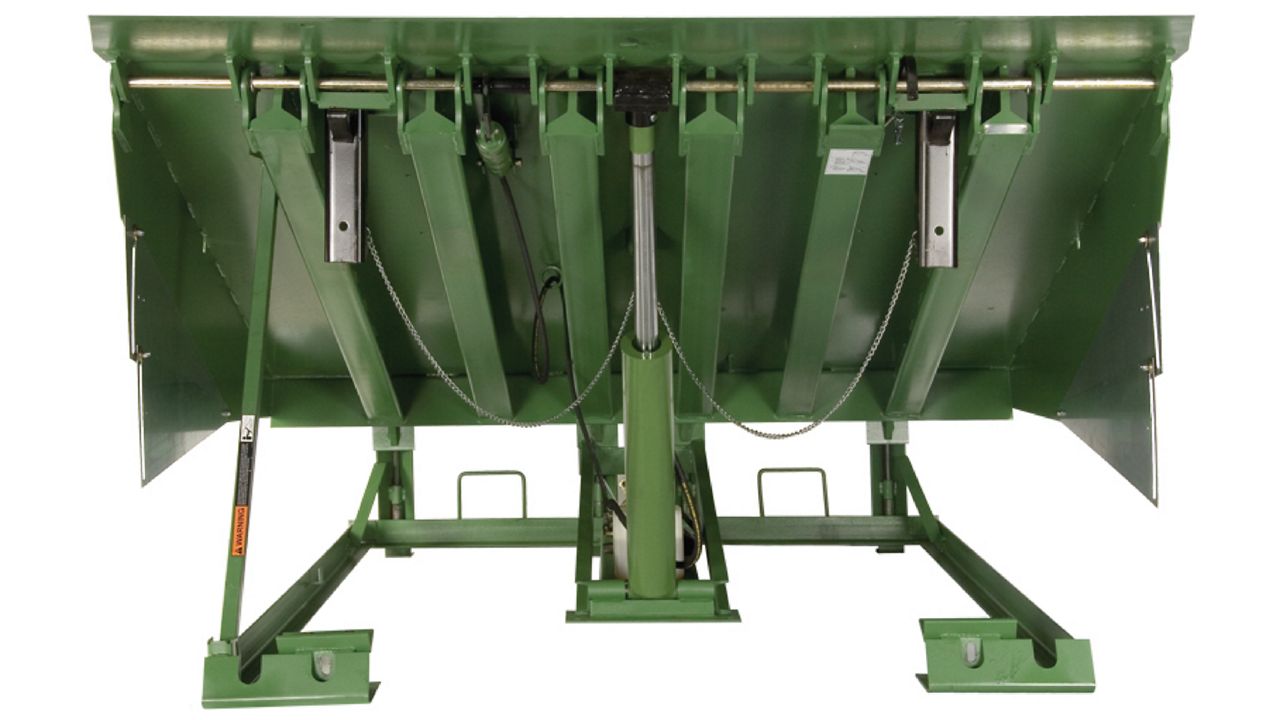 Hydraulic-powered pit-style loading dock leveler.