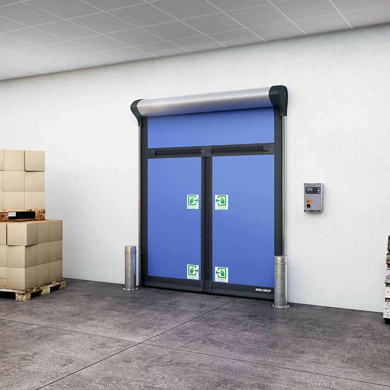 A blue compact door in the centre and stacks of grey bricks on the sides of the door. 