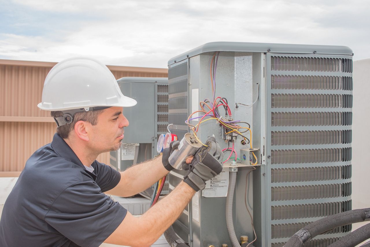 HVAC technician workin on equipment