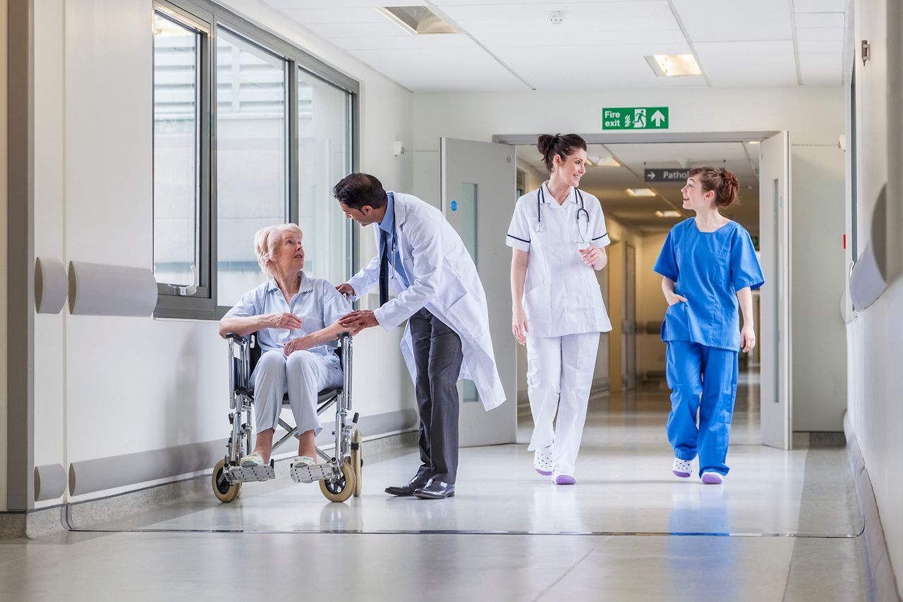 Staff and patient in hospital environment