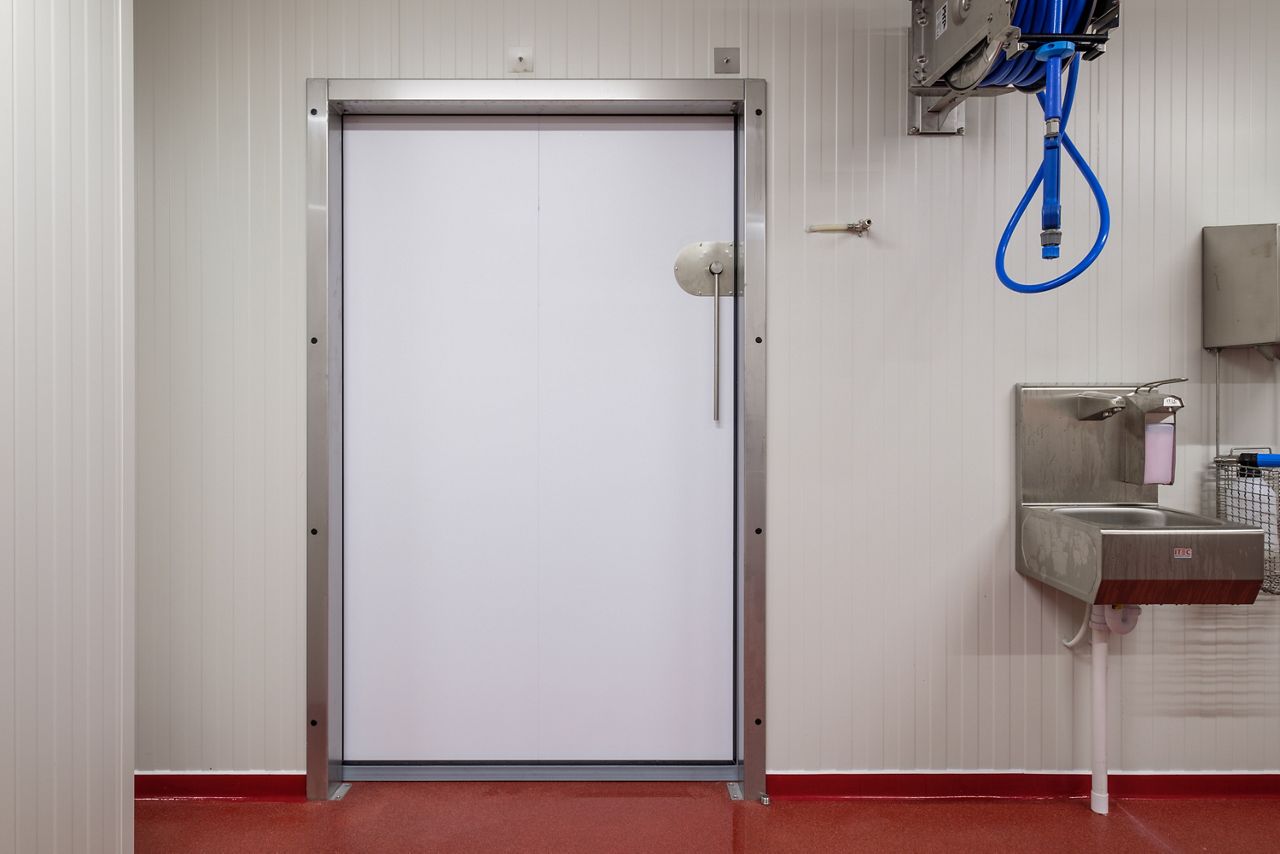 sliding refrigerator door suitable for a food-safe environment.