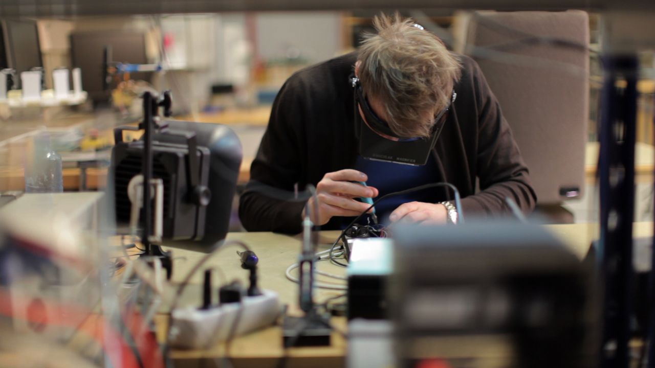 Man in black shirt working in a innovation lab