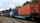 A train with multicolored cars on a track