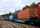 A train with multicolored cars on a track