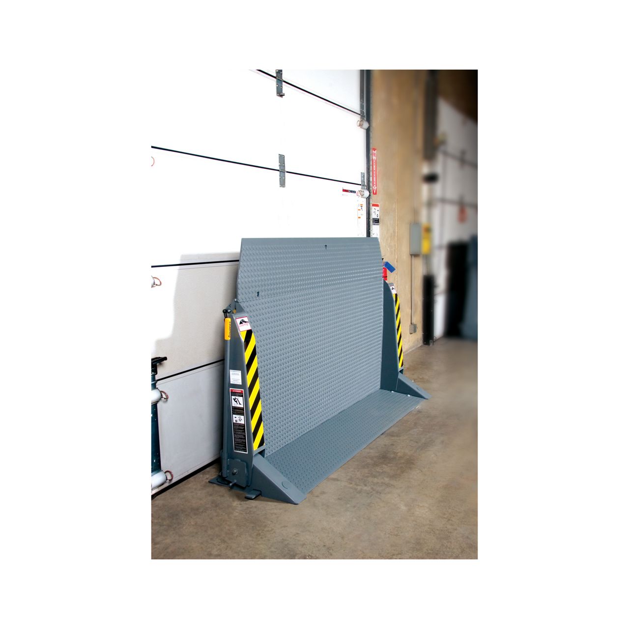 View of surface-mounted dock bridge in use at a warehouse.