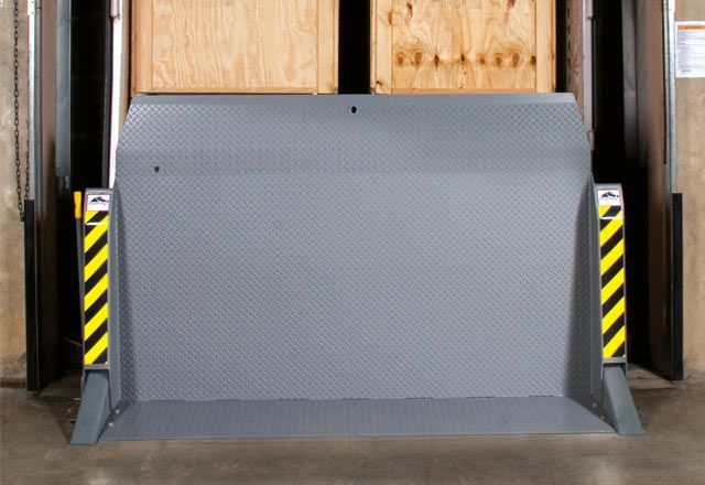 Image: The LH Loadhog Dock Bridge stored inside a warehouse facility.