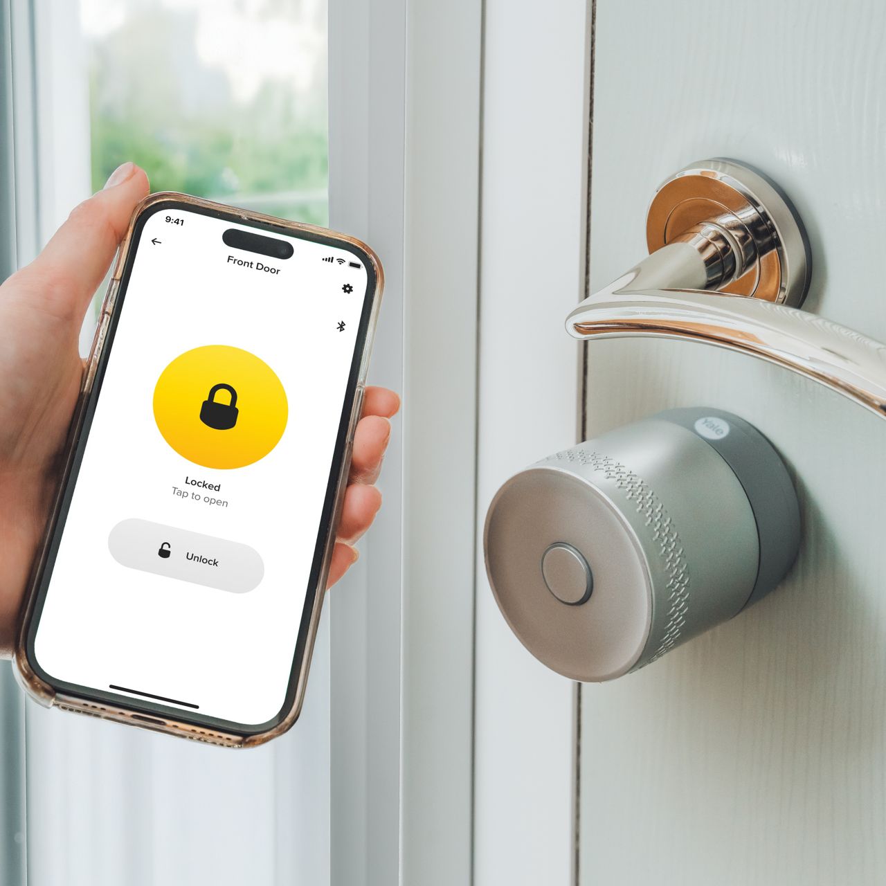 Image: Smart lock with glowing red LED ring and sleek metallic door handle on dark door