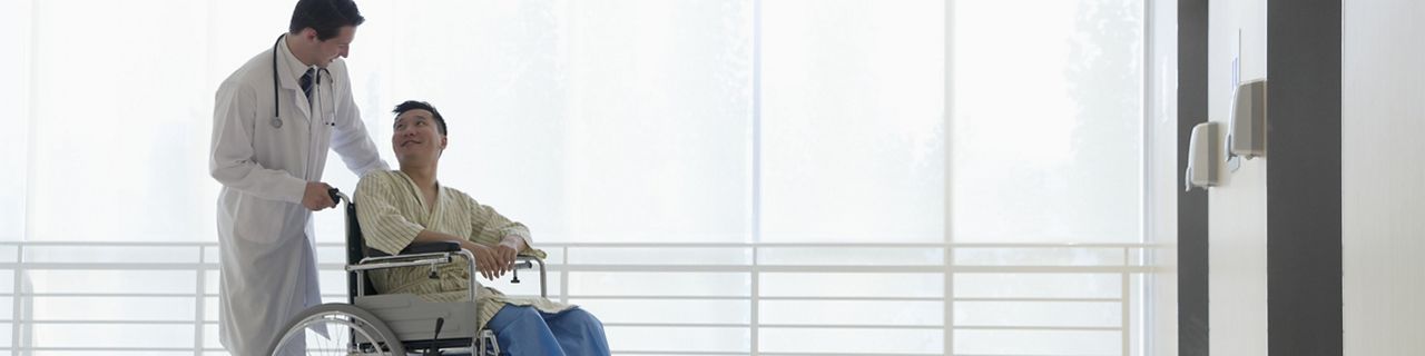 Doctor with patient in wheelchair