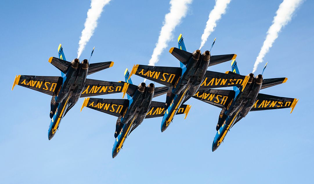 U.S. Navy jets flying in the sky.