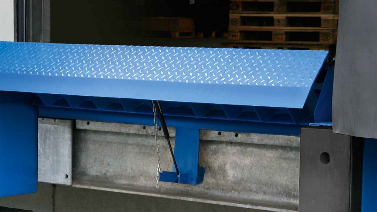 Installation of a blue swingdock minidock leveler. 