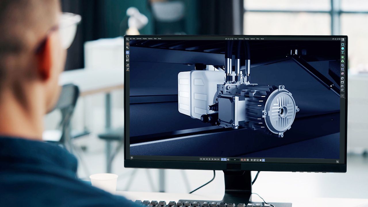 Person som granskar en 3D-modell av en industrikomponent på en datorskärm