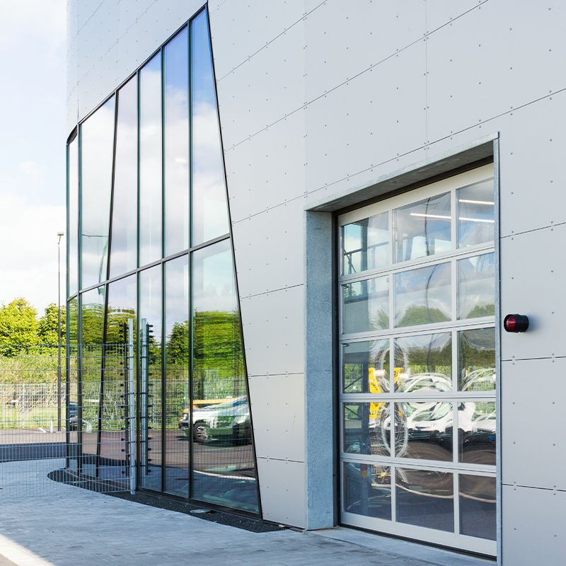 A glass glazed insulated door at a car dealers. 