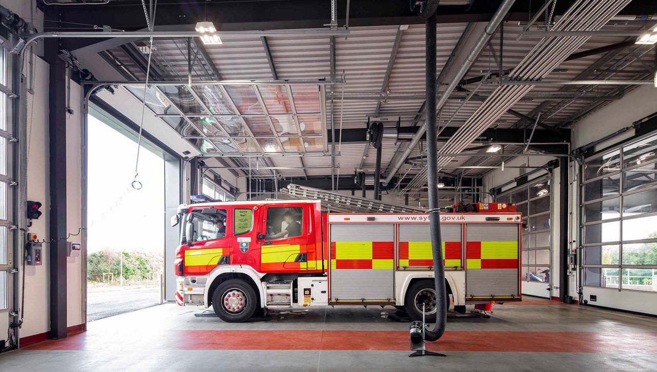 Internal image of Crawford OH1042F Overhead Sectional Door in the lift postition at fire station located in the UK