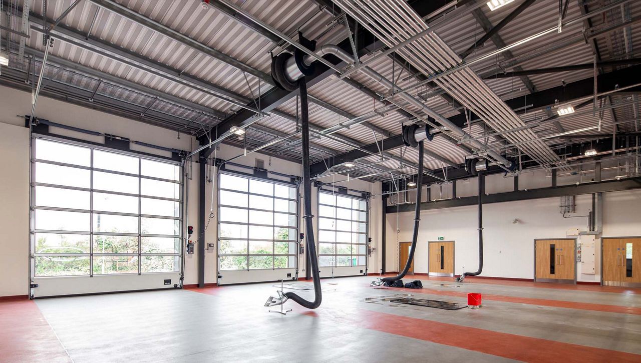 A row of Crawford OH1042F Overhead Sectional Door at fire station located in the UK