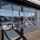 An external image of a Crawford OH1042F Overhead Sectional Door in a service bay at a BMW car dealership in the UK