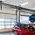 An internal image of a Crawford OH1042F Overhead Sectional Door in a service bay at a BMW car dealership in the UK