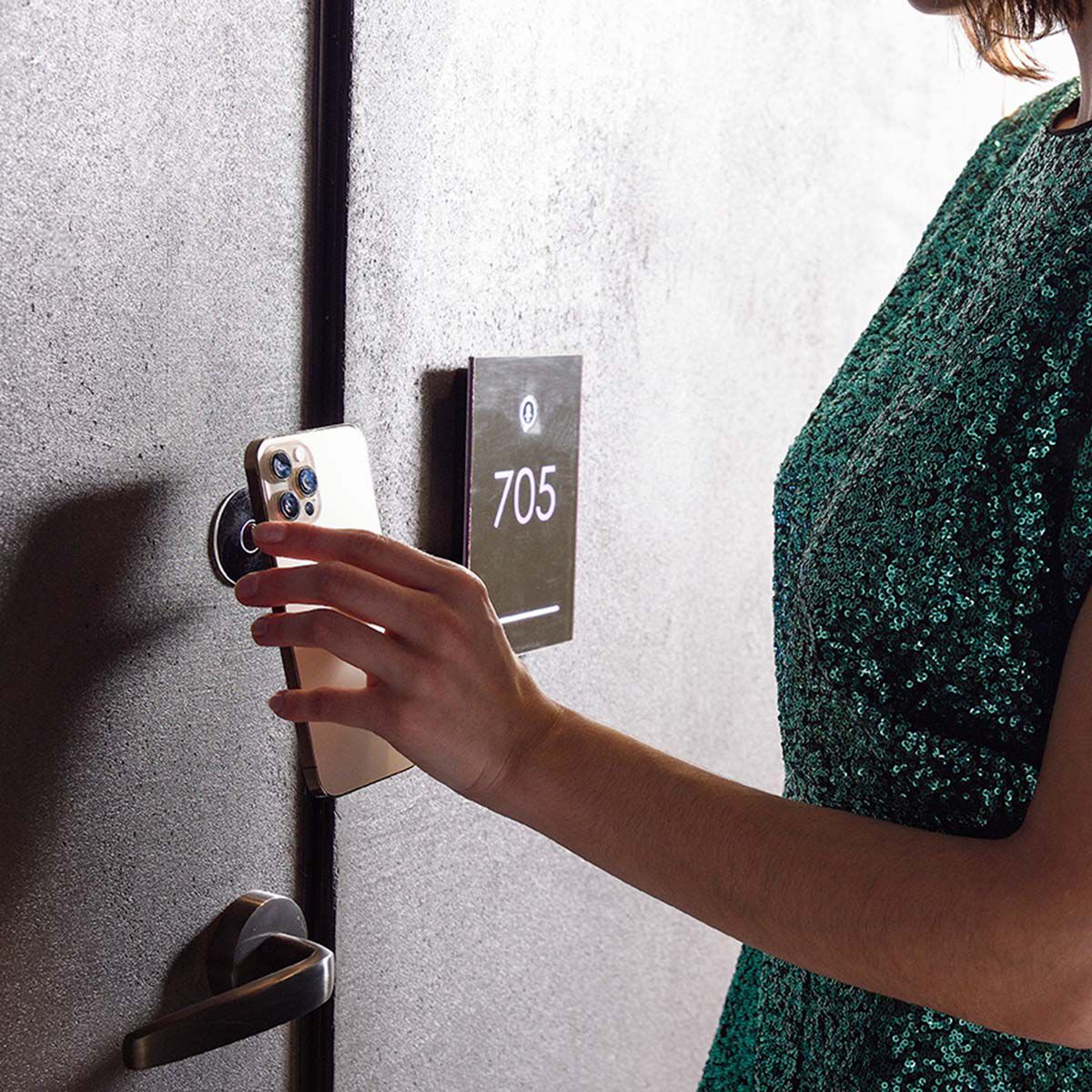 Woman opening hotel room door