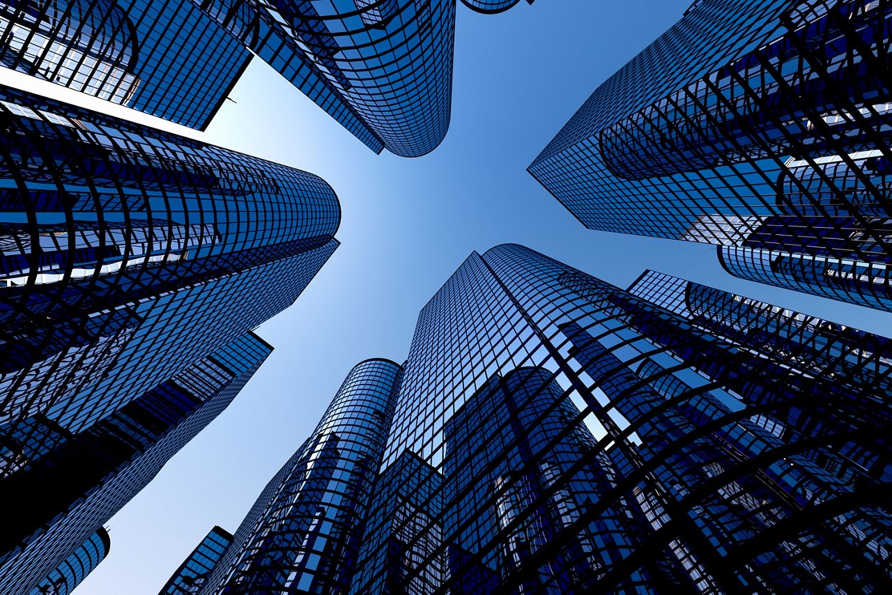 Reflective skyscrapers against dark blue sky