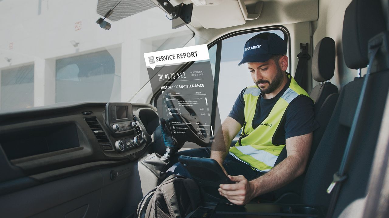 service tech in van looking at tablet