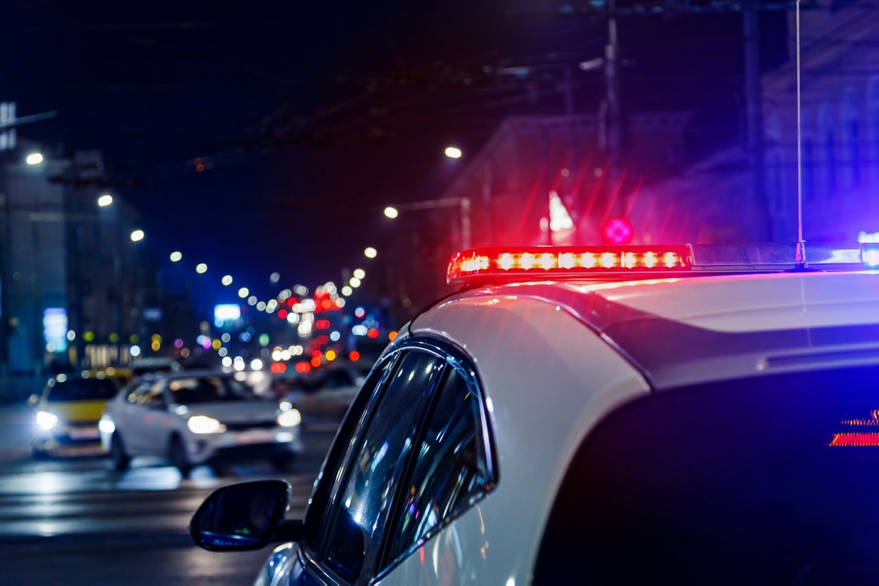 Police patrol car on the street at night