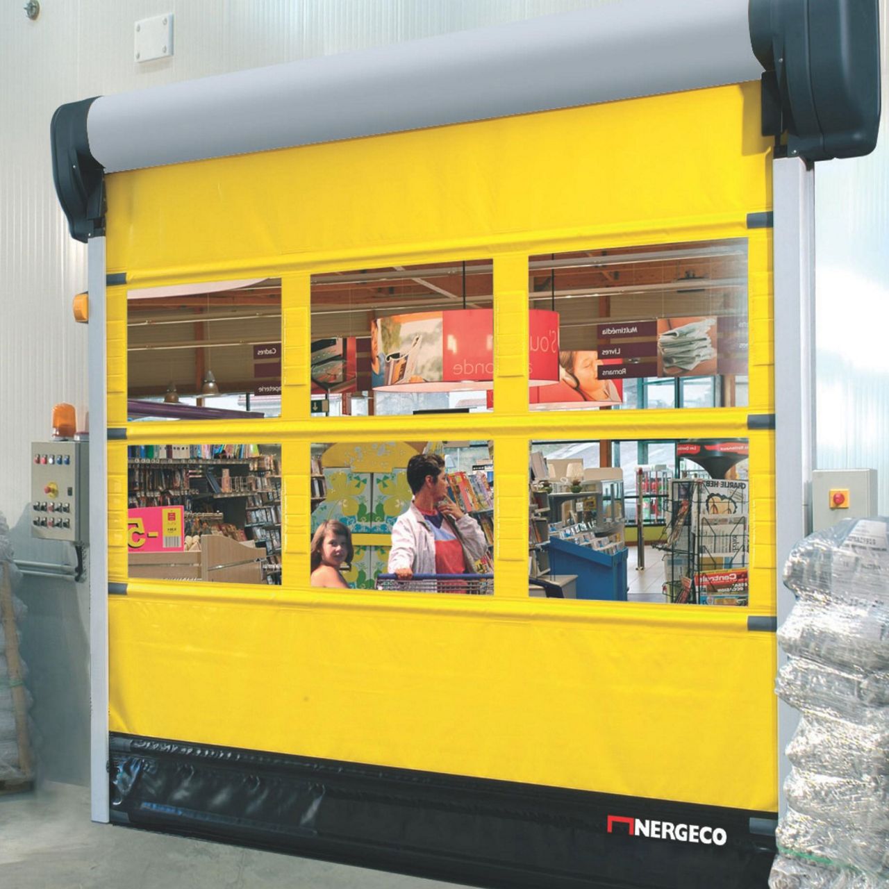 A yellow door with printes windows. 