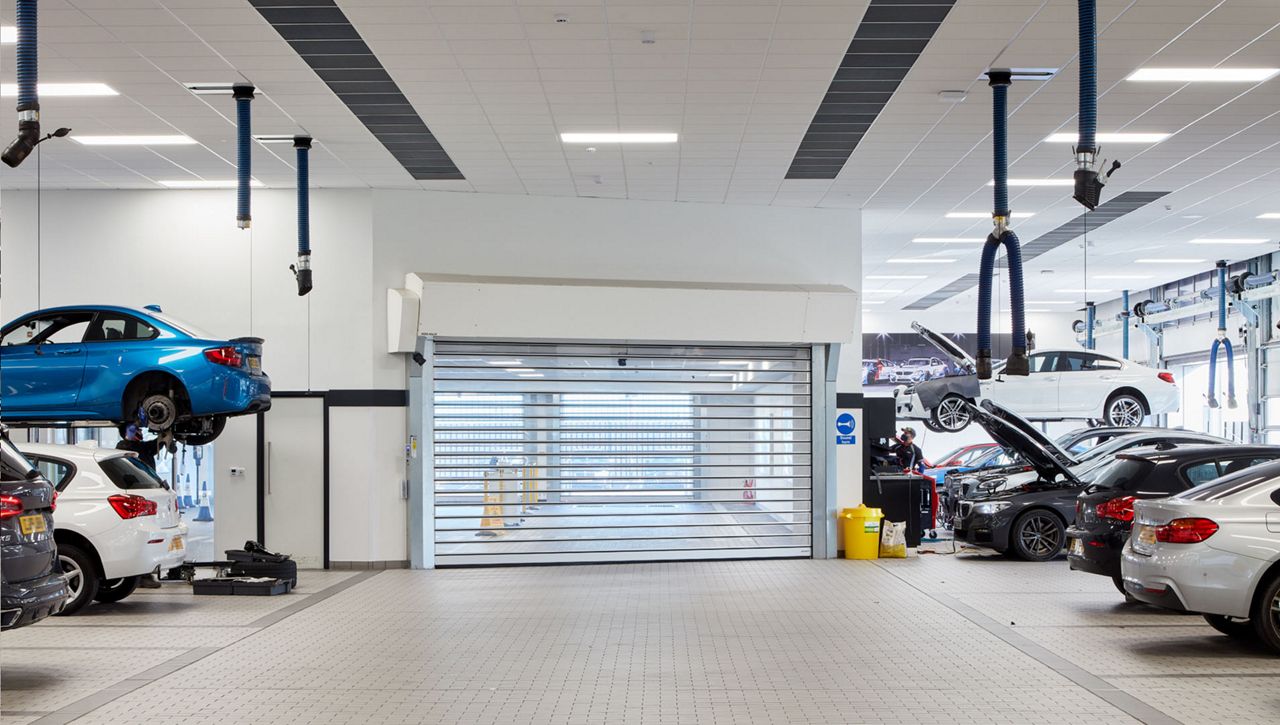 Internal view of a BMW MOT service bay with an RR3000 ISO high speed door
