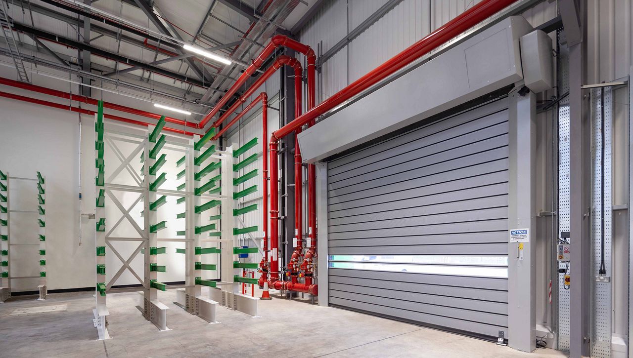 ASSA ABLOY RR5000 Rigid High Speed Door installed in a manufacturing environment