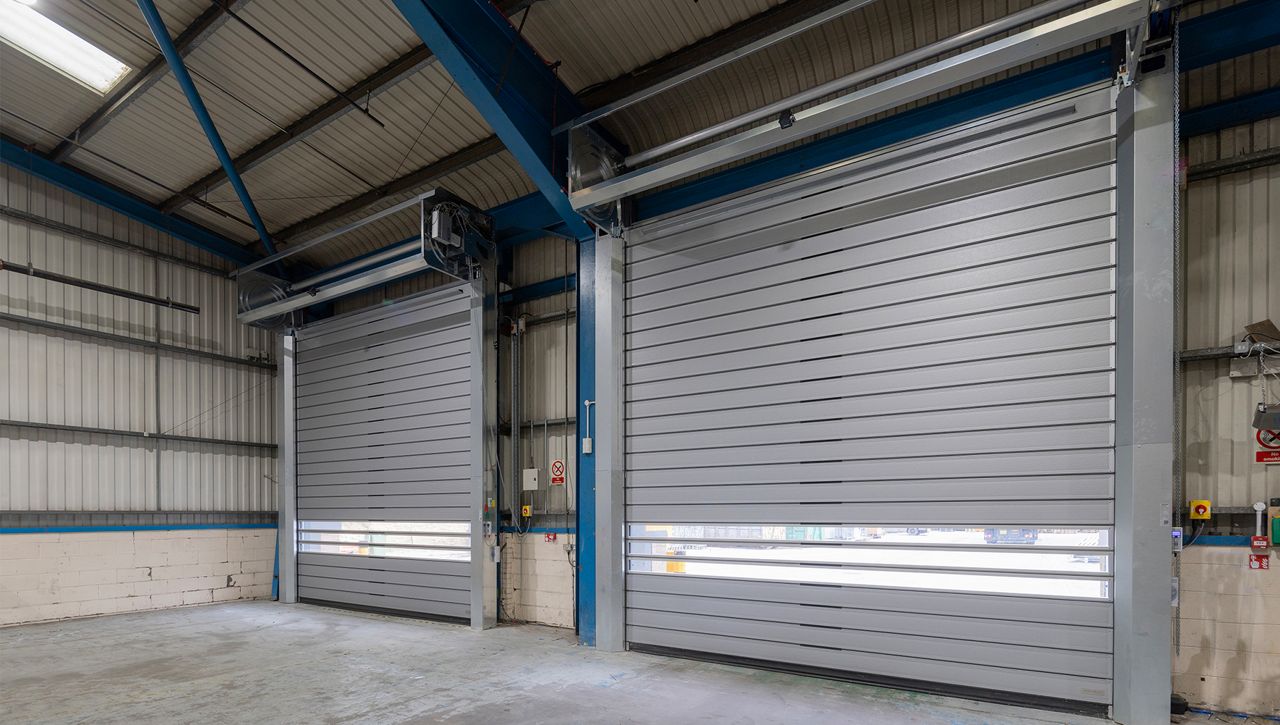 Interior view of the ASSA ABLOY RT1000 high-speed spiral door with horizontal vision panels, installed in a logistics facility