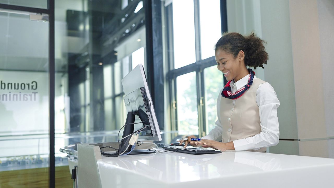 Rental car agent at computer