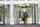 Man entering a building lobby through a rotating door