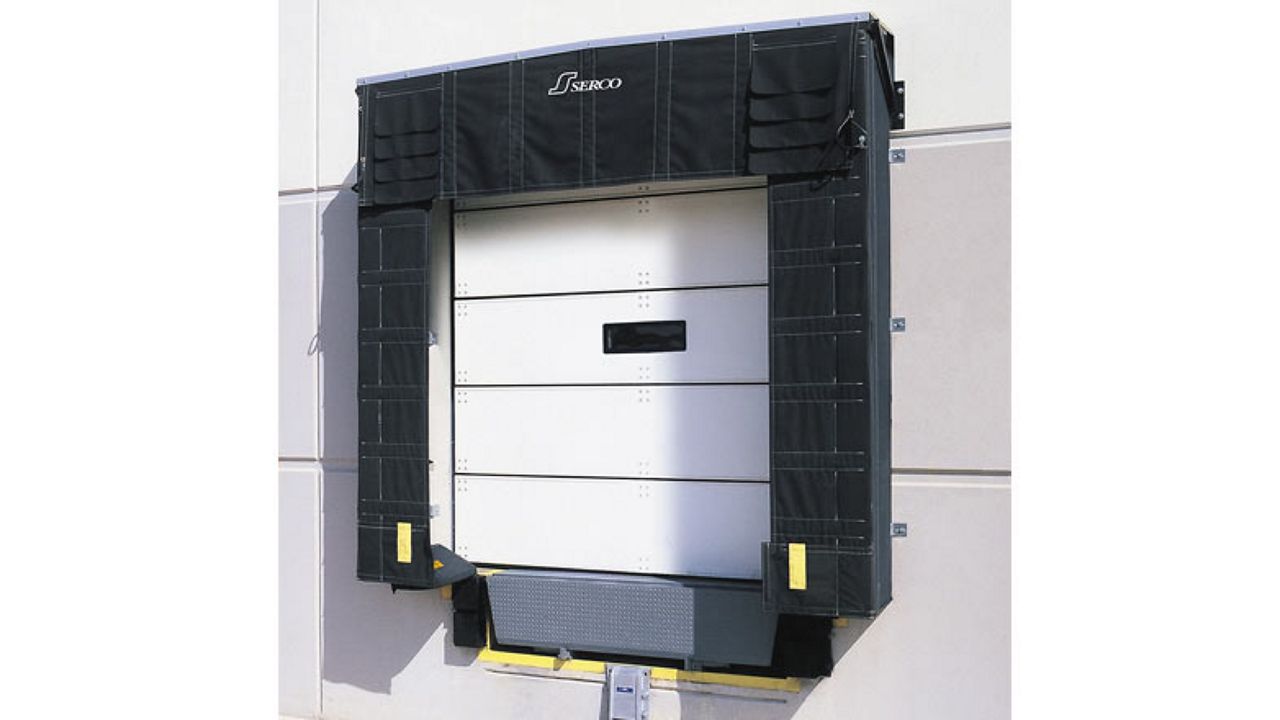 A white door with a black dock shelter.