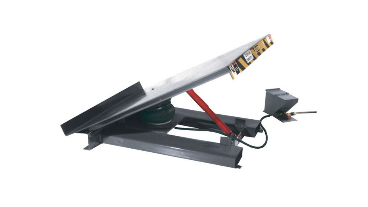 A gray air tilter lift on a white background