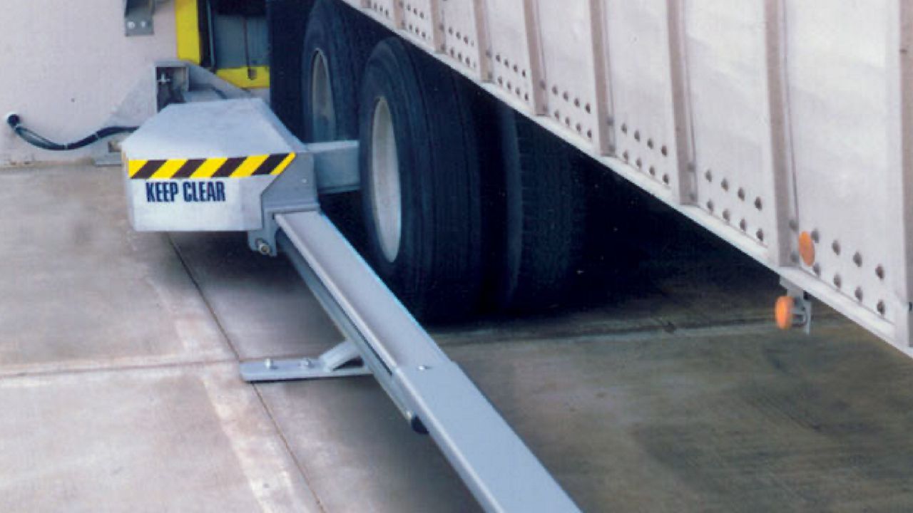  A surface-mounted device engineered for dependable wheel restraint and vehicle safety.