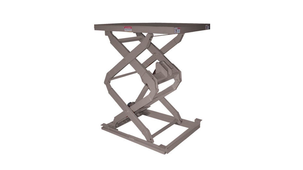 A gray double scissors lift on a white background