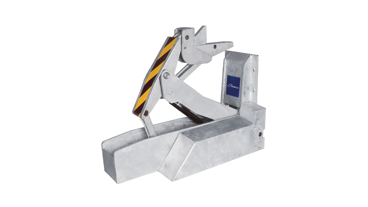 A silver, powered trailer restraint.