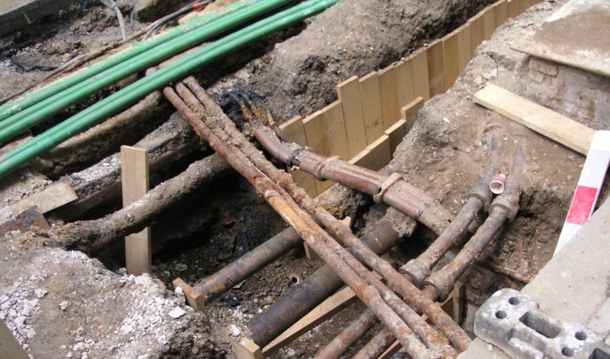 Underground utilities just below the surface in a city.