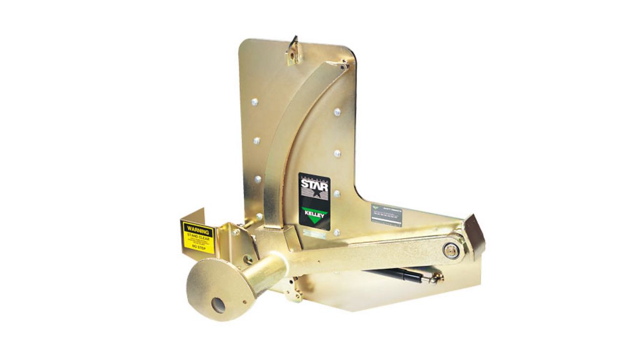 A gold-colored industrial equipment component with a curved design, labeled with safety warnings and the Kelley STAR logo.