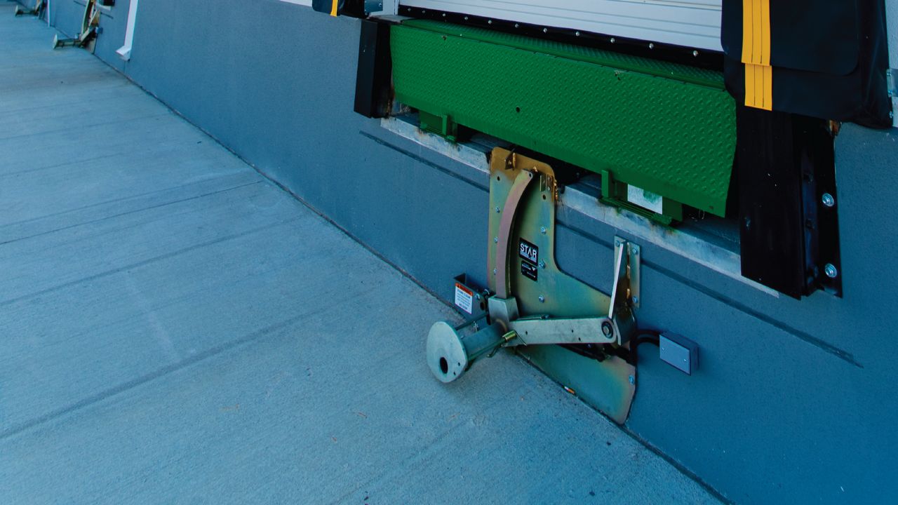 Star2 set up properly under a rollup door outside of a warehouse. 