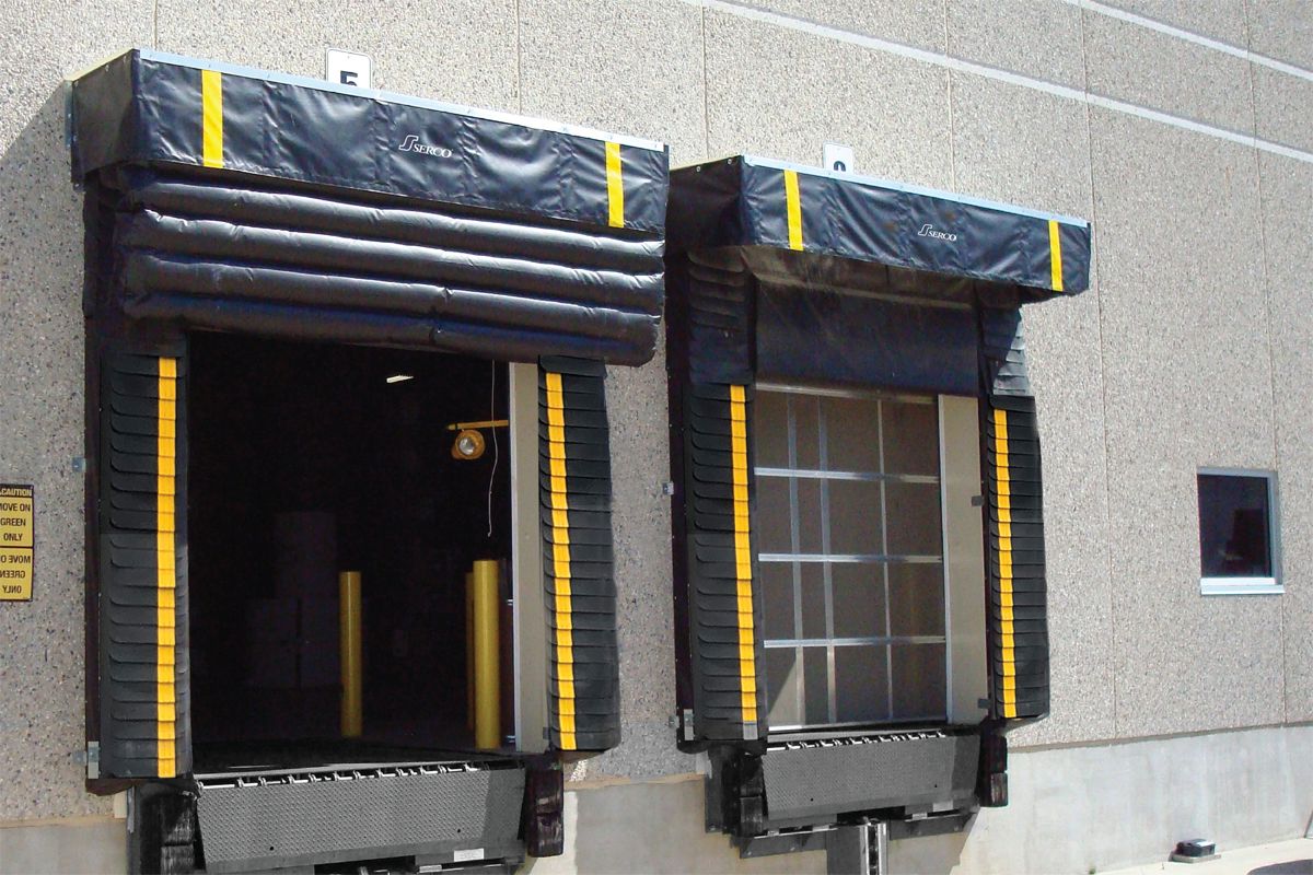 Serco SI-325 dock shelters installed at exterior loading dock doors with one inflated shelter.  