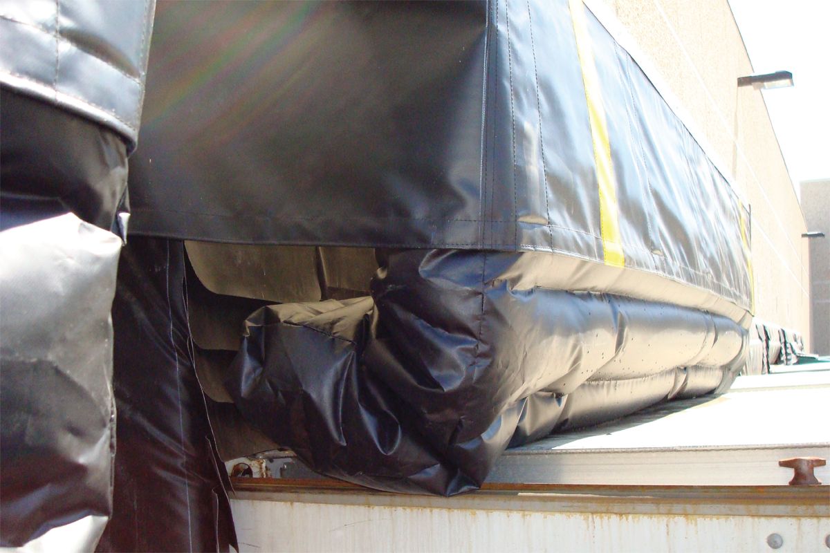 Image: Close-up side view of the Serco SI-325 dock seal installed against a trailer at a loading dock.