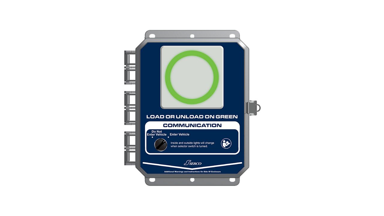 Image: A gray and blue Serco MLS panel with a green circle in the middle signaling 'Go.'