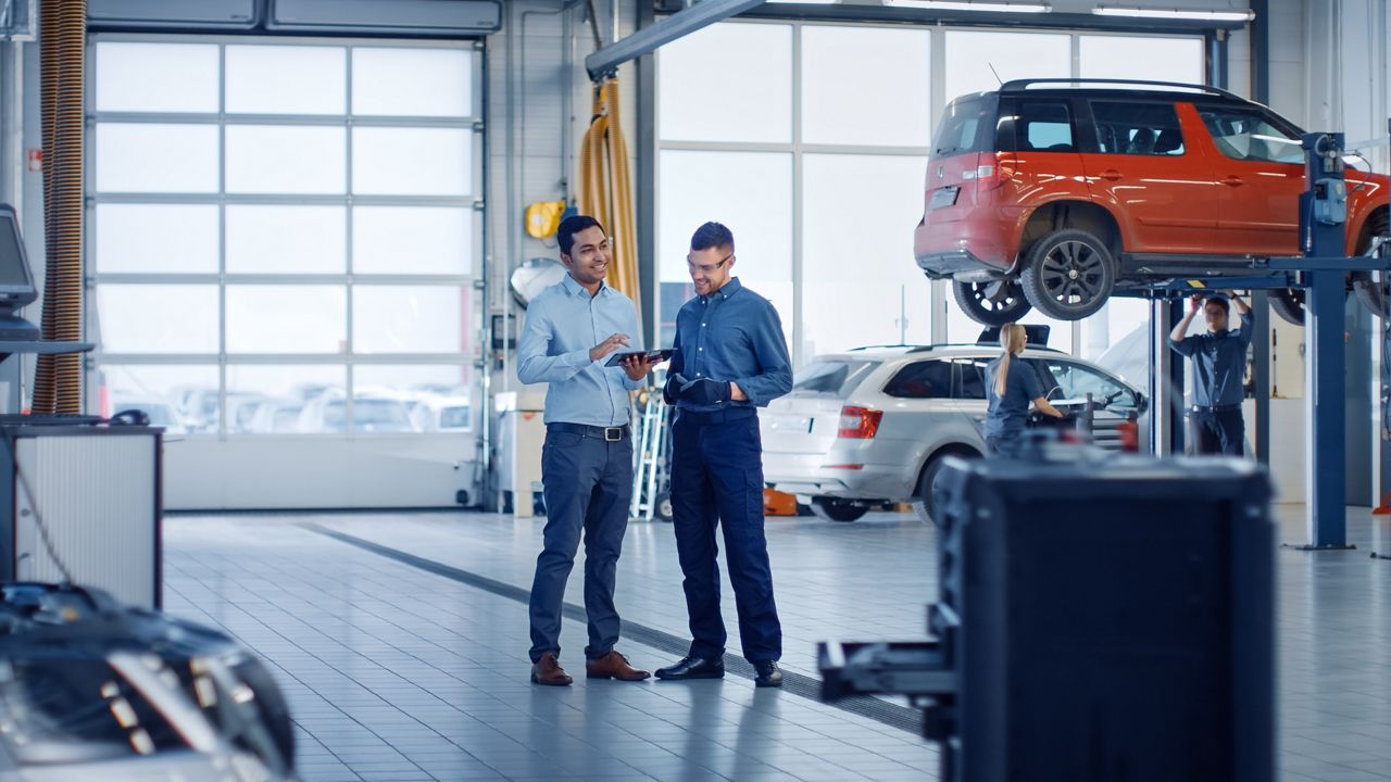 Service department staff in service bay