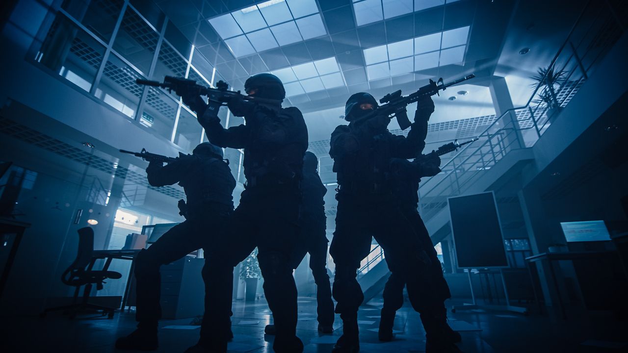 Tactical SWAT team entering a building