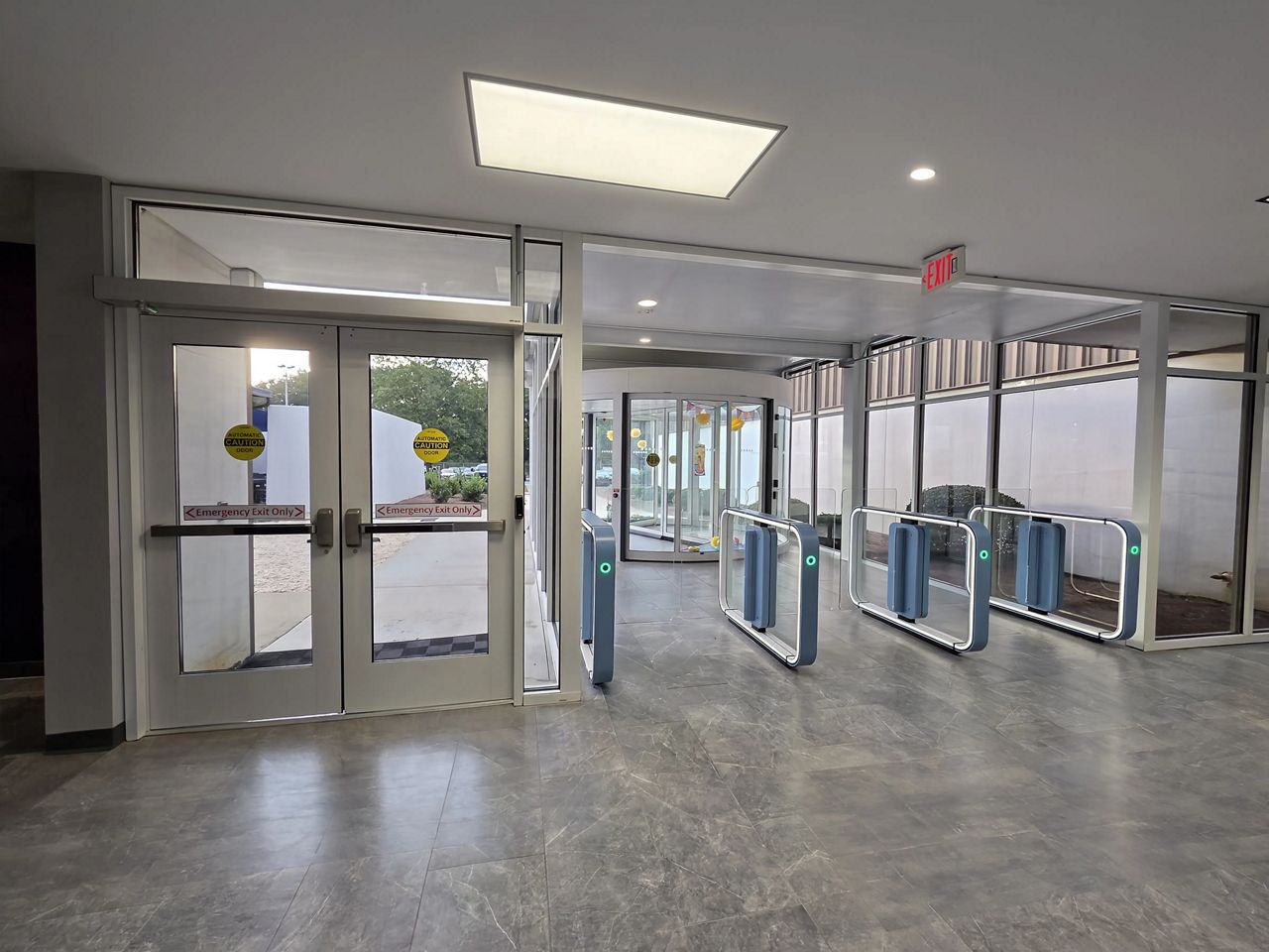 Entrance showing swing door, revolver, and speedgates.