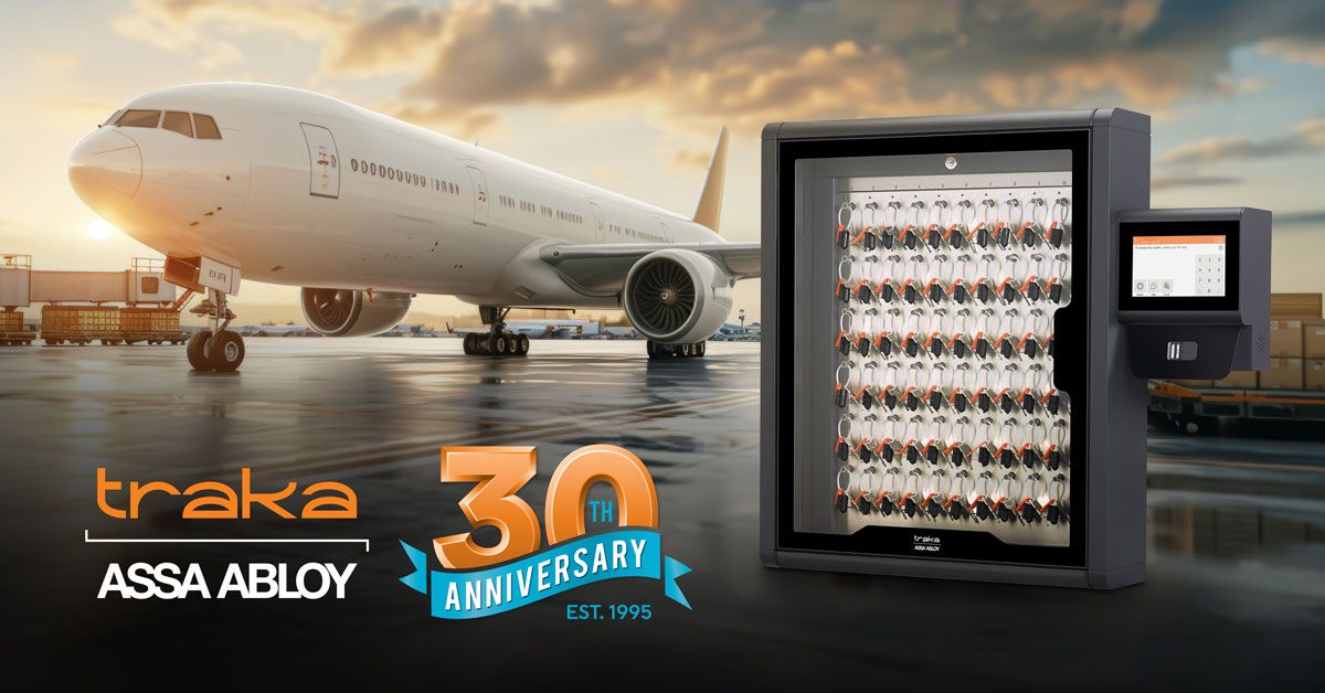 An airplane on an airport tarmac at sunset with a Traka key management system in the foreground. Logos for Traka, ASSA ABLOY, and a “30th Anniversary, Est. 1995” badge are displayed.