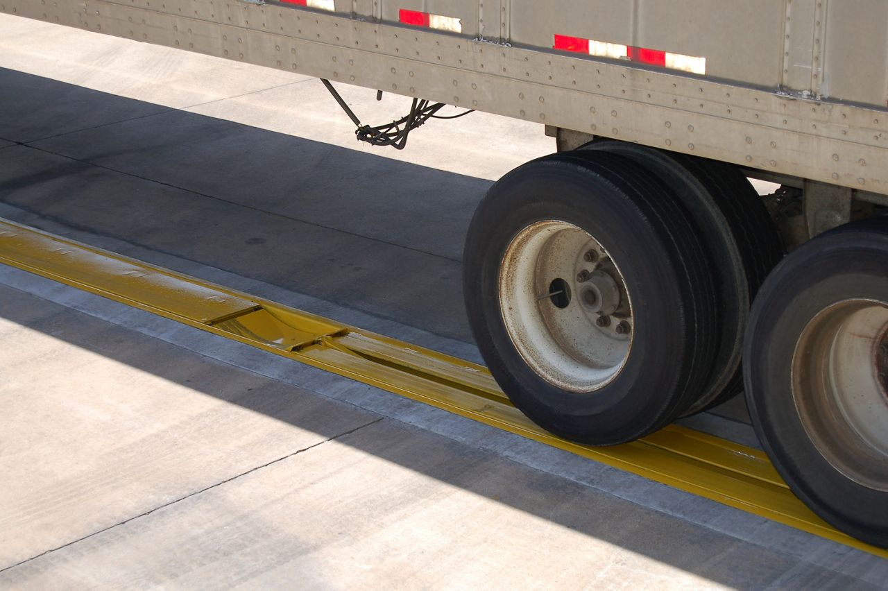 Image: The UTC Wheel Restraint in use, in the ground under a truck.