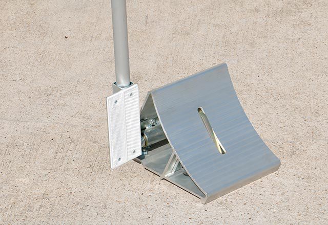 Image: Close up view of the bottom of  the Versachock™ Wheel Chock Wireless Restraint.