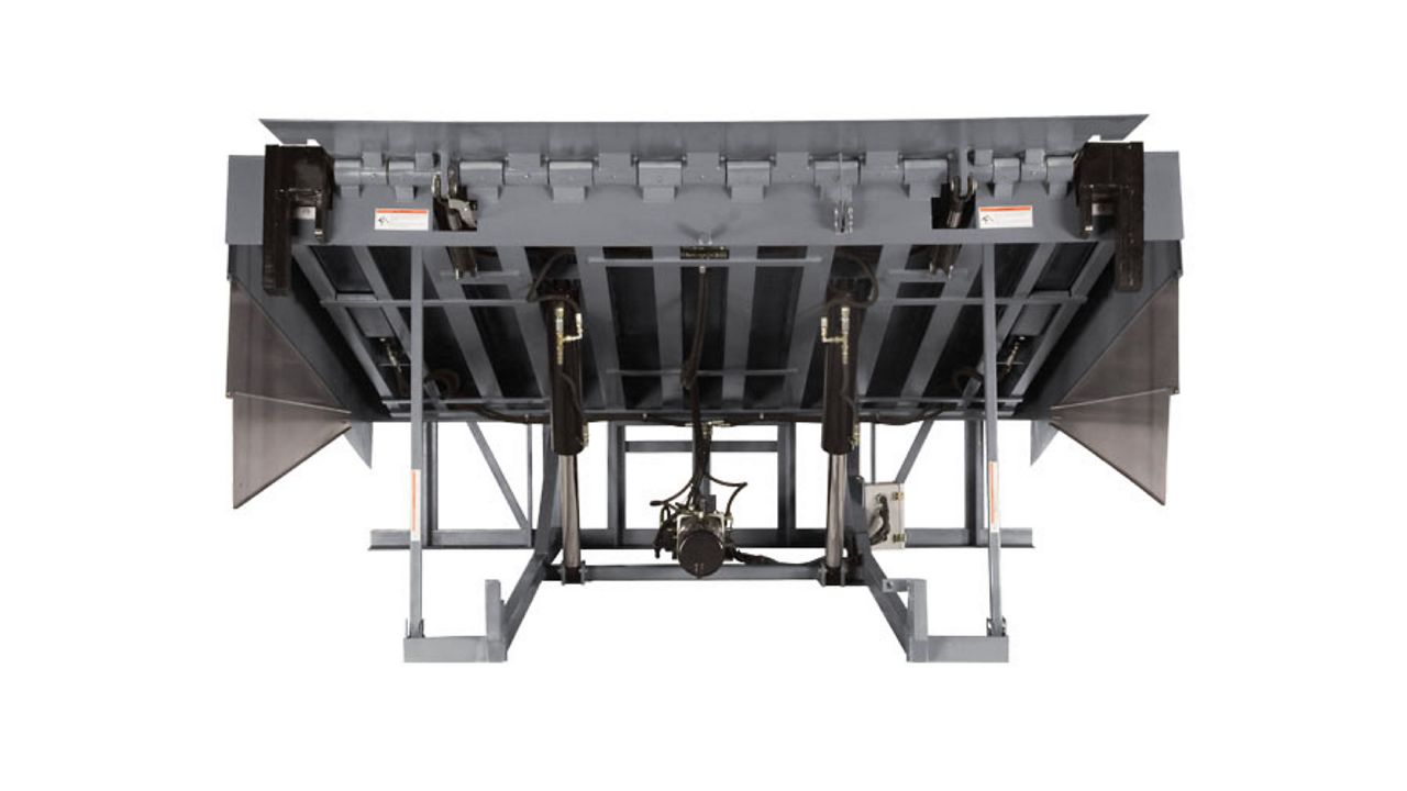 A tall silver dock leveler with long side panels and a front panel.