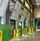 A line of green vertical storing loading docks inside of a warehouse